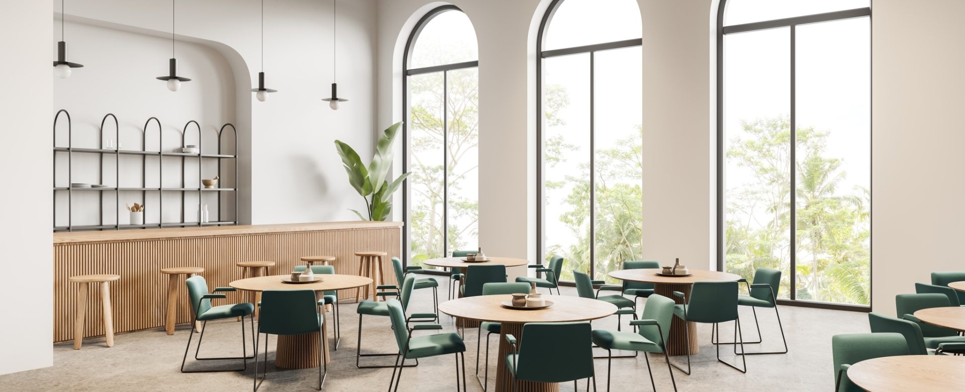 Large, arched windows in a commercial cafe setting.