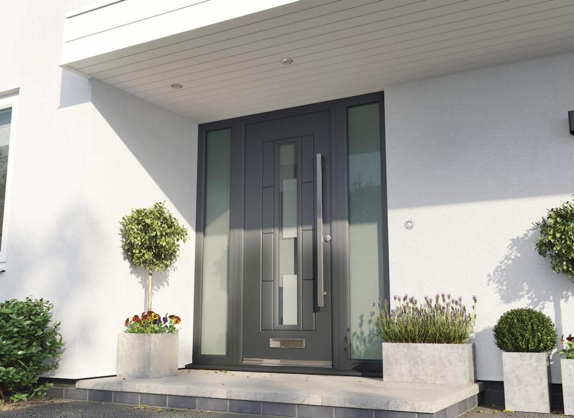 Rockdoor composite front external door in Anthracite Grey Vermont Shade, with glass panels on either side and a centre glass panel.