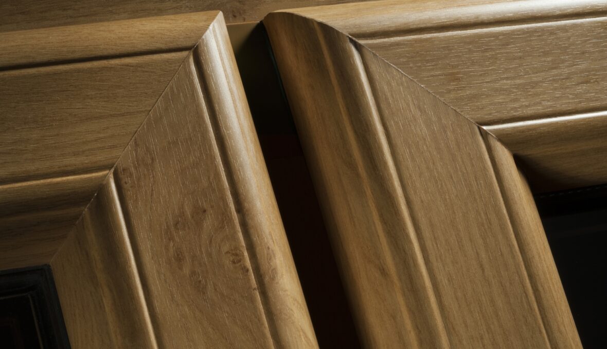 Close up of timber alternative uPVC windows in an oak finish.