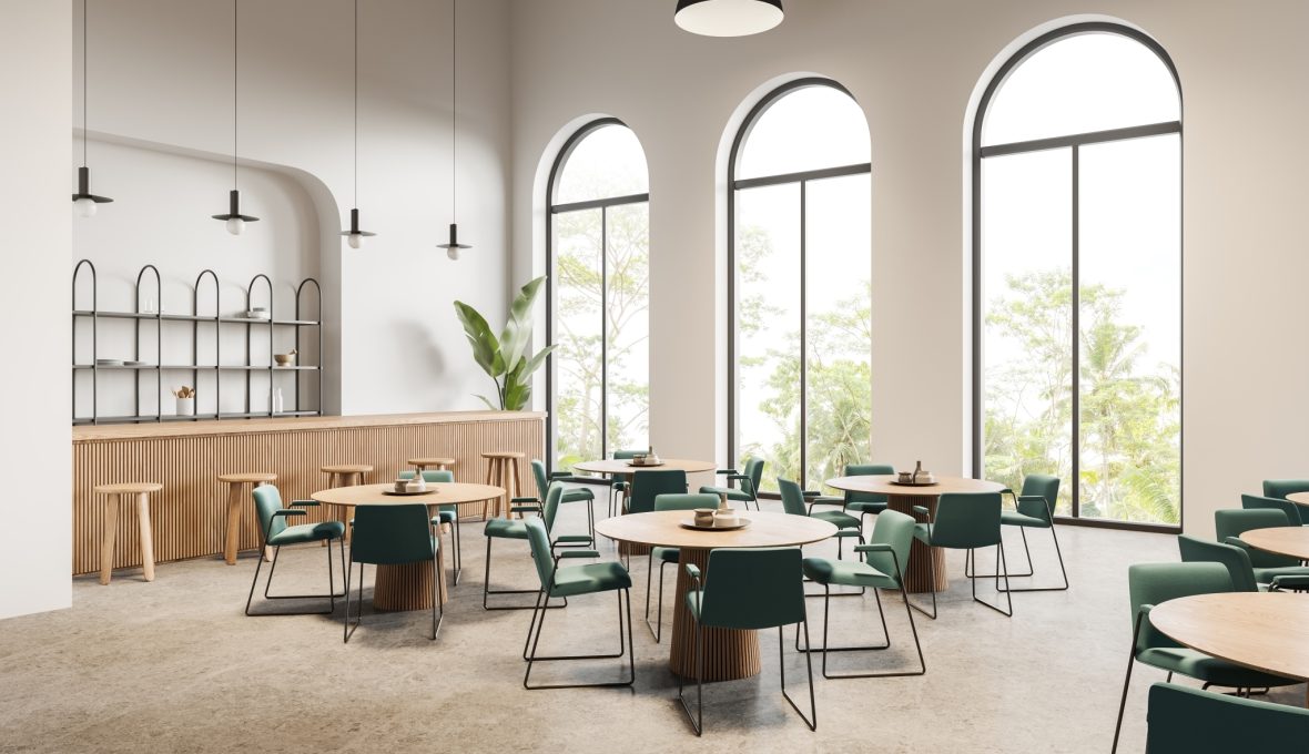 Large, arched windows in a commercial cafe setting.