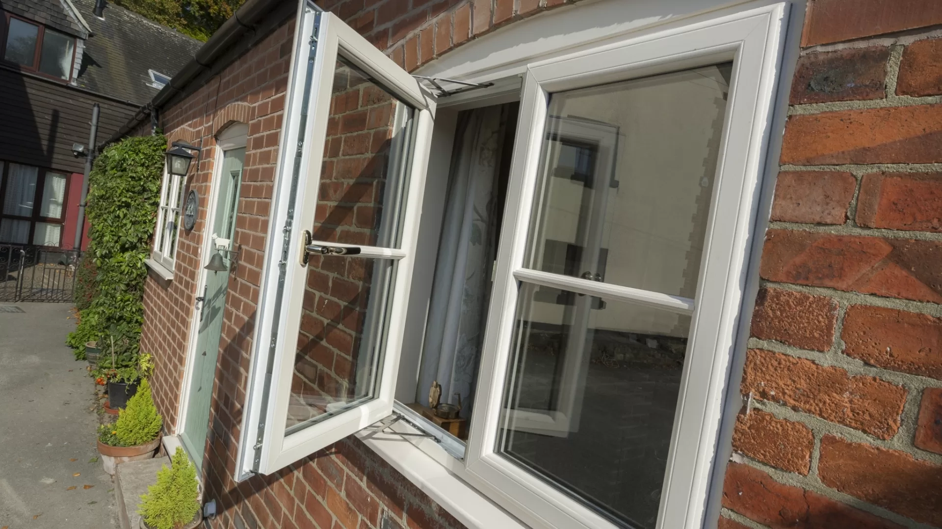White uPVC casement window with two panels, one open.