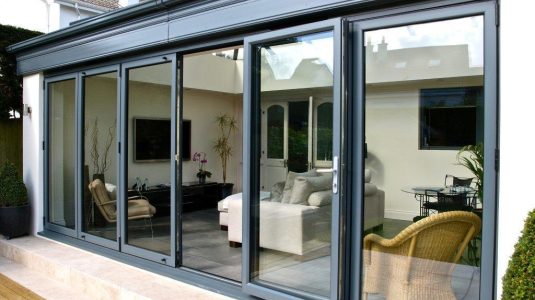 Bifold aluminium doors with modern, stylish black frames.