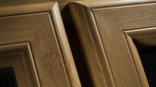 Close up of timber alternative uPVC windows in an oak finish.