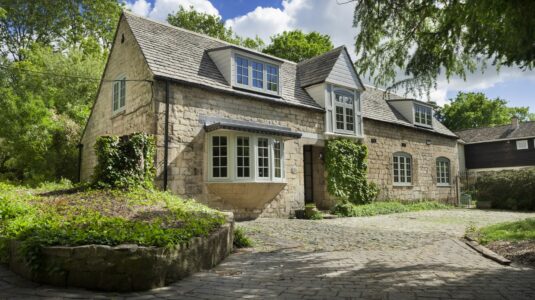 Stunning home with bay windows by Keswick Superglaze