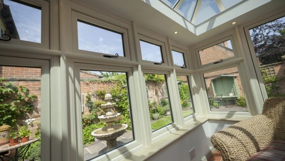 Interior of an orangery conservatory home extension with cream window casements.